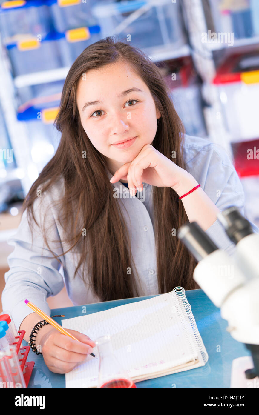 Schoolgirl in biology class Stock Photo