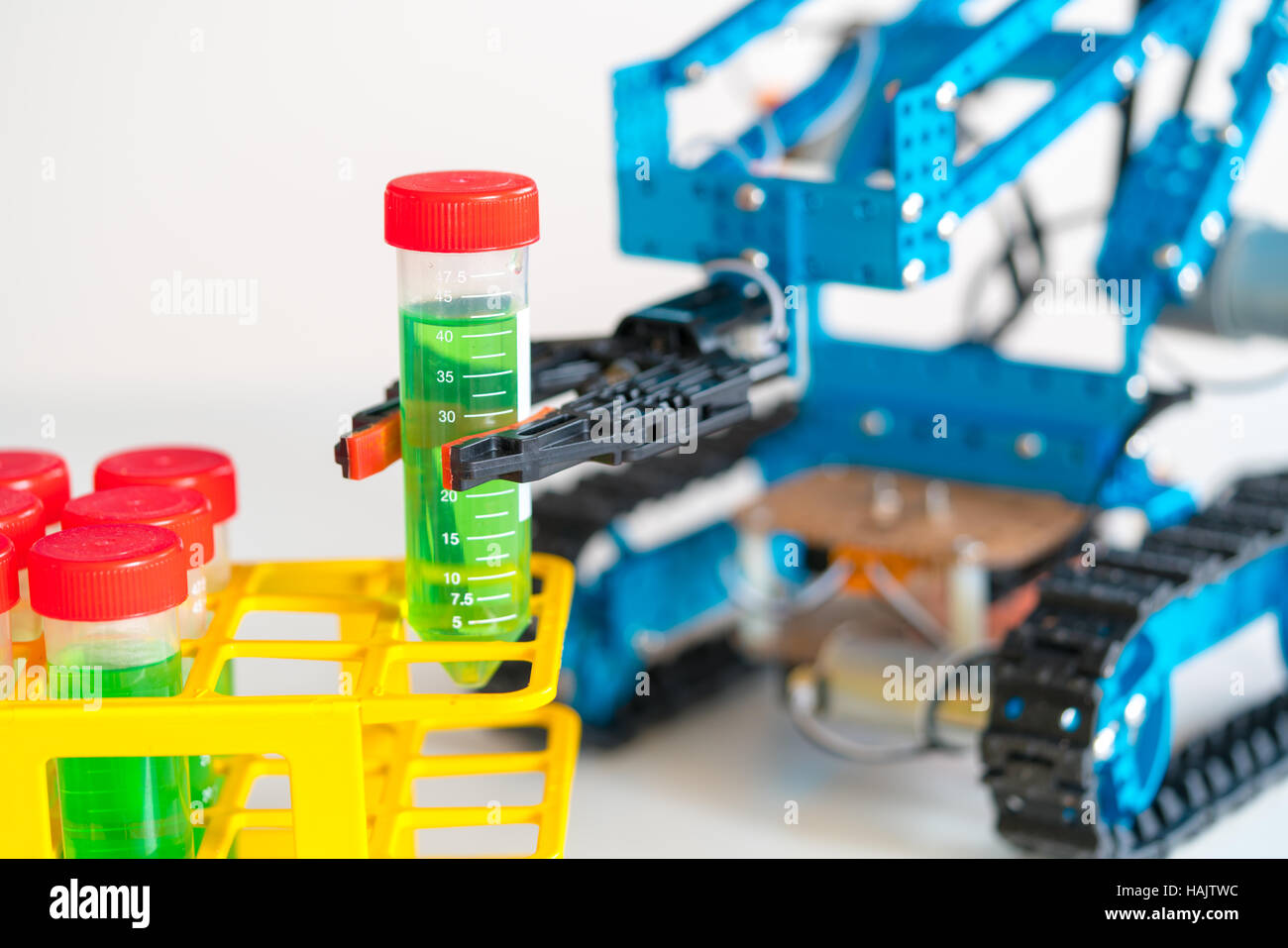 The robot arm tracks on doing an experiment with dangerous chemicals ...