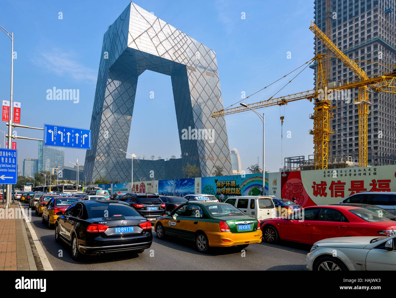CCTV Tower - Cars are stuck in heavy traffic on East Third Ring Road at front of the tower of China Central Television Tower. Stock Photo