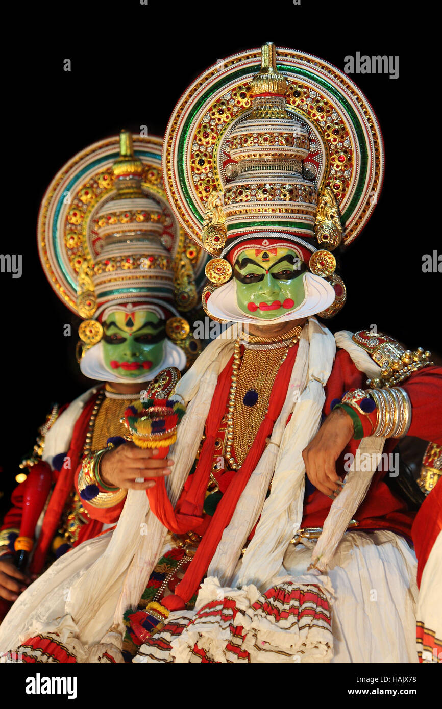 Kathakali dancers on stage, Kathakali is dance from the state of Kerala, India,  performed with colorful costumes and masks Stock Photo