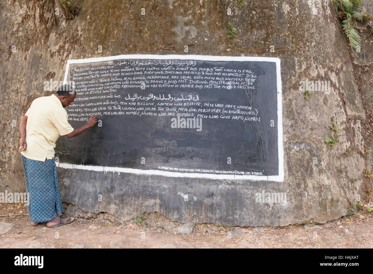 A man expressing his views in a public notice board, Kochi, Kerala