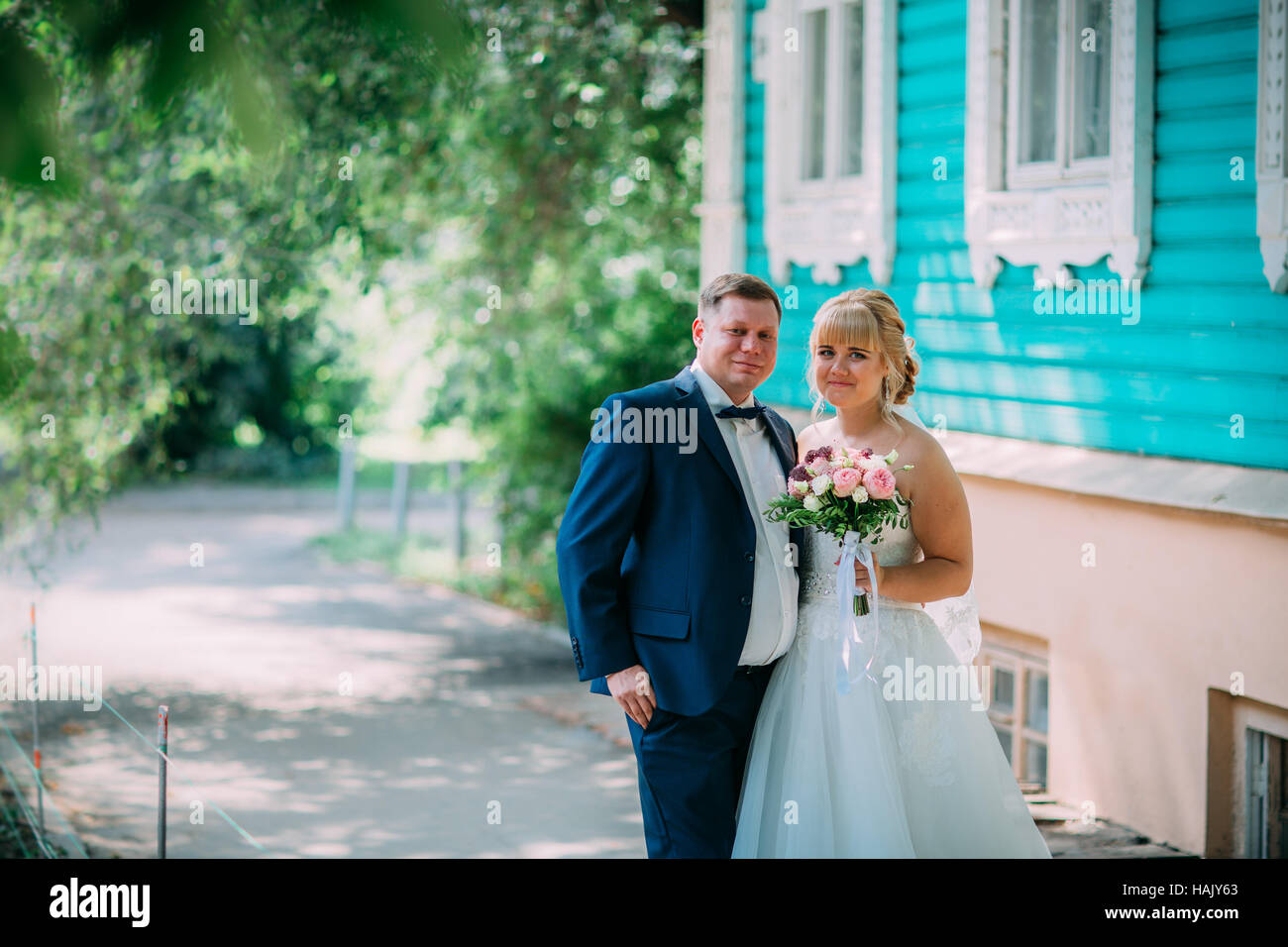 bride and groom on the background of the city Stock Photo - Alamy