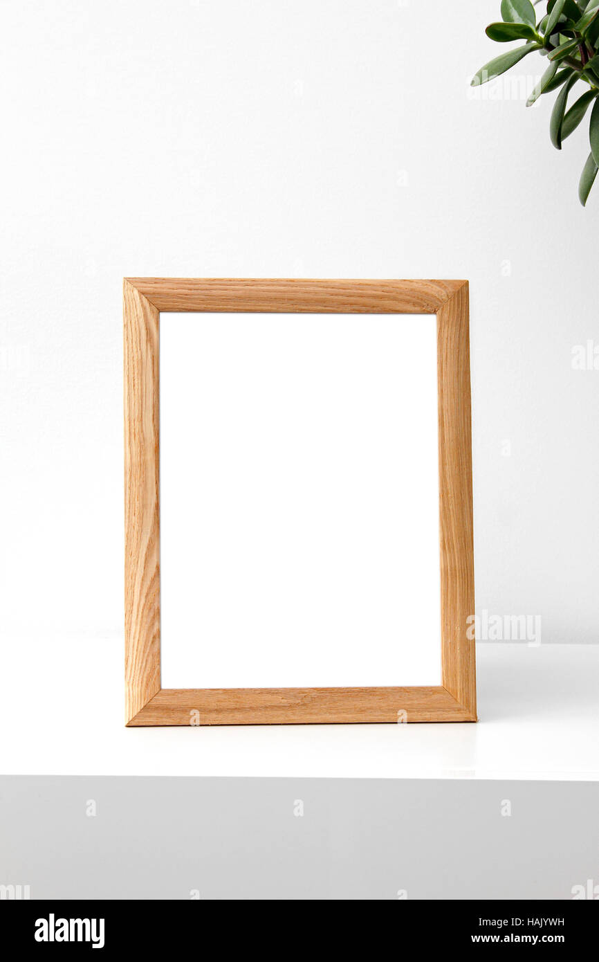 blank photo frame on table in the room Stock Photo