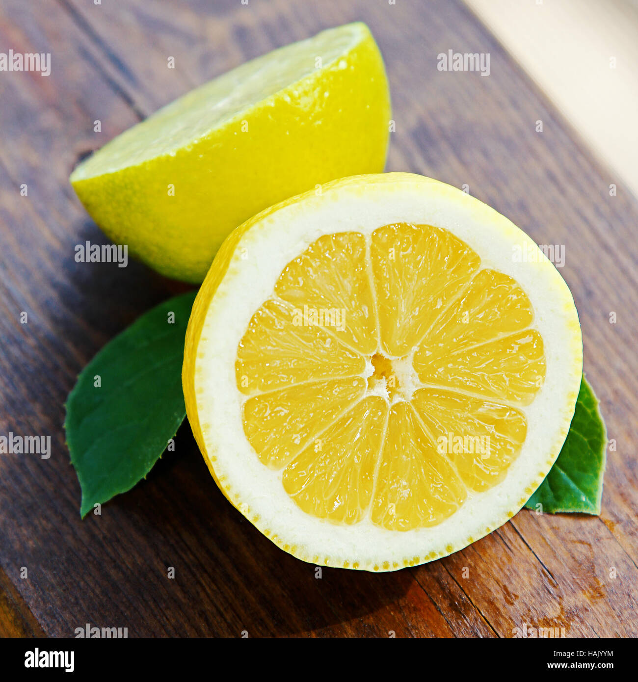 fresh lemon and lime on wooden table Stock Photo