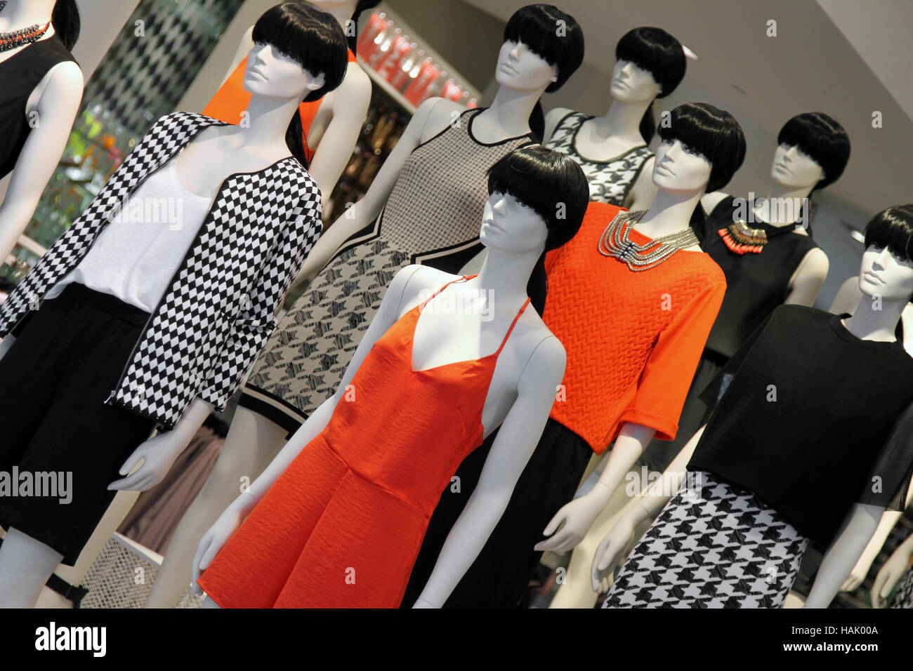 many fashion mannequins in the shop window Stock Photo