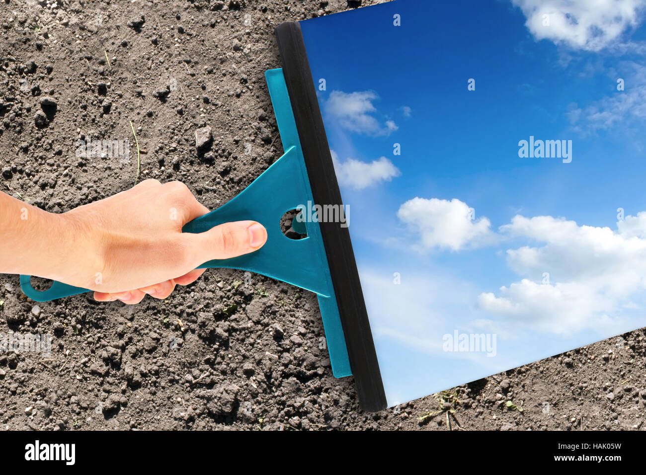hand with window cleaning tool Stock Photo