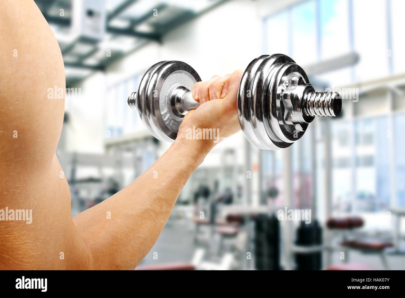 gym. man with dumbbell in the hand Stock Photo