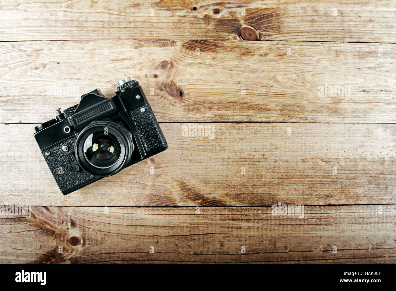 old vintage photo camera on wooden table Stock Photo