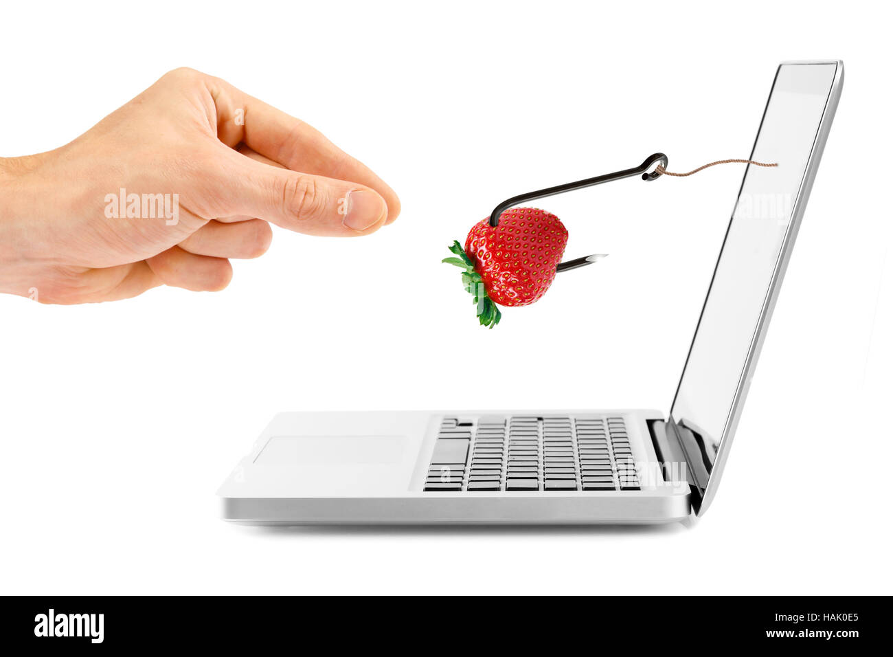 internet fraud concept. hook with bait through laptop screen Stock Photo