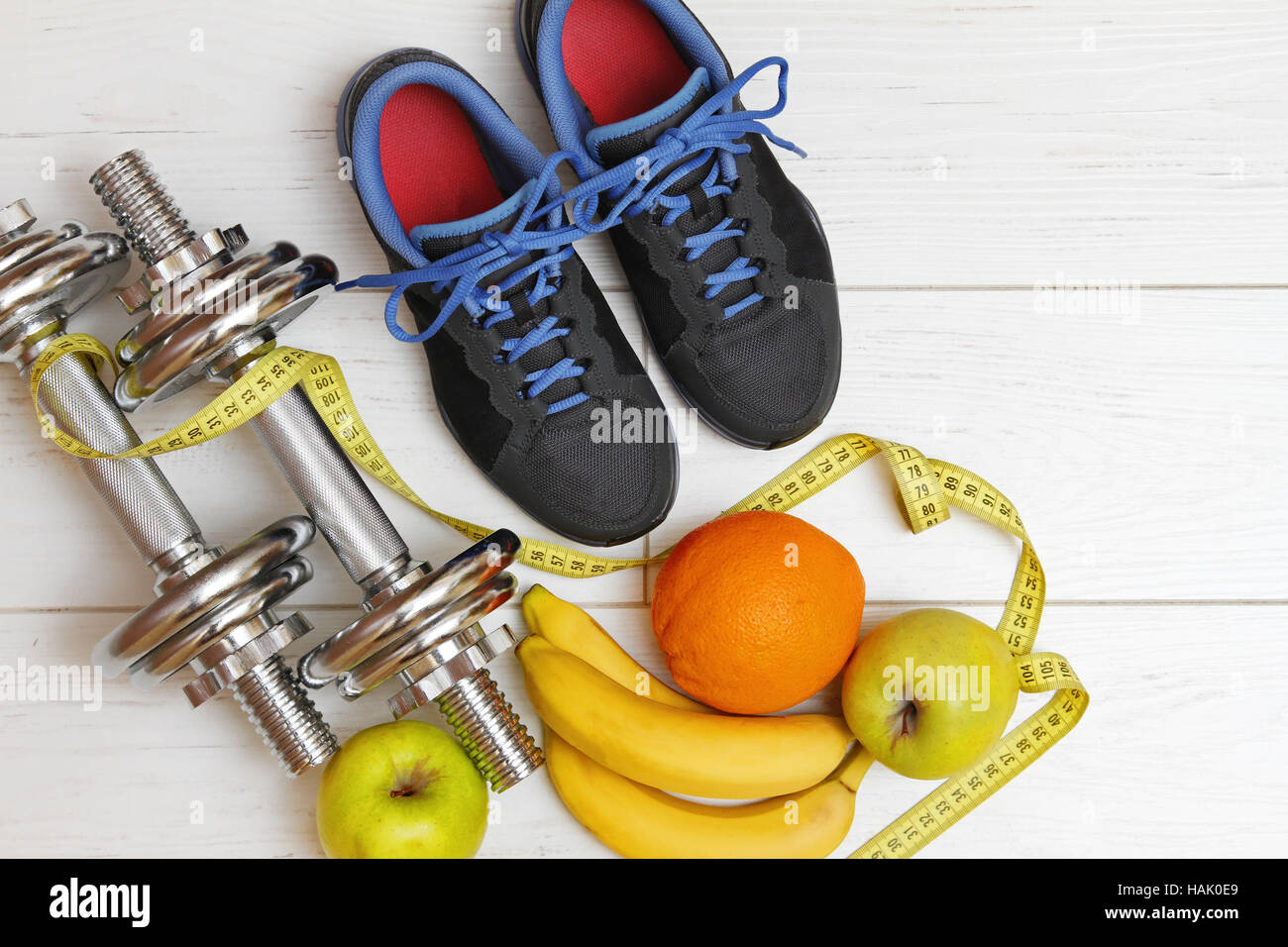 fitness equipment and healthy nutrition on white wooden plank floor Stock Photo