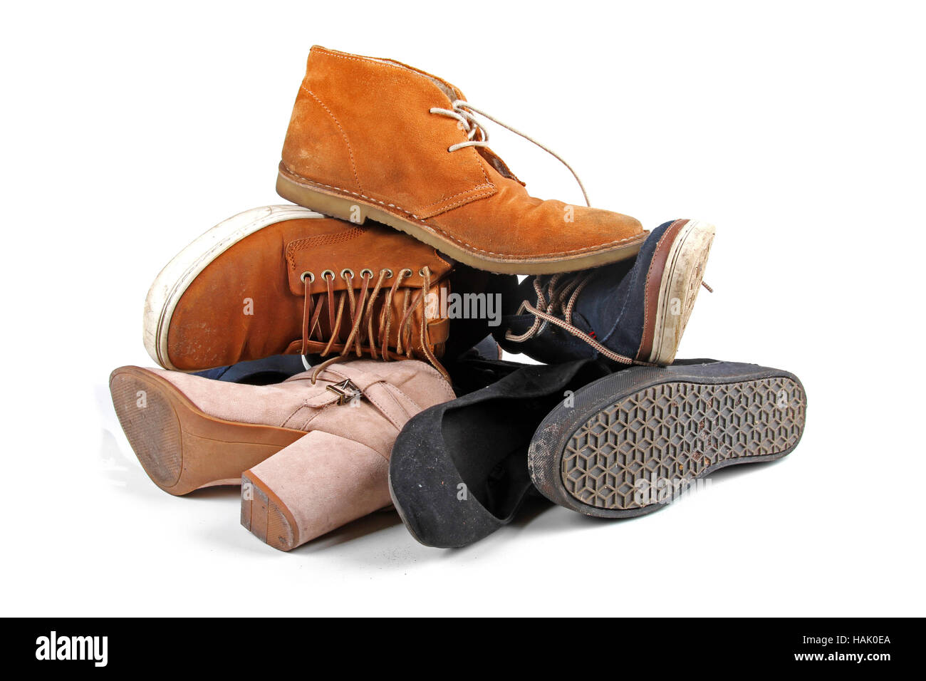 pile of various shoes isolated on white background Stock Photo