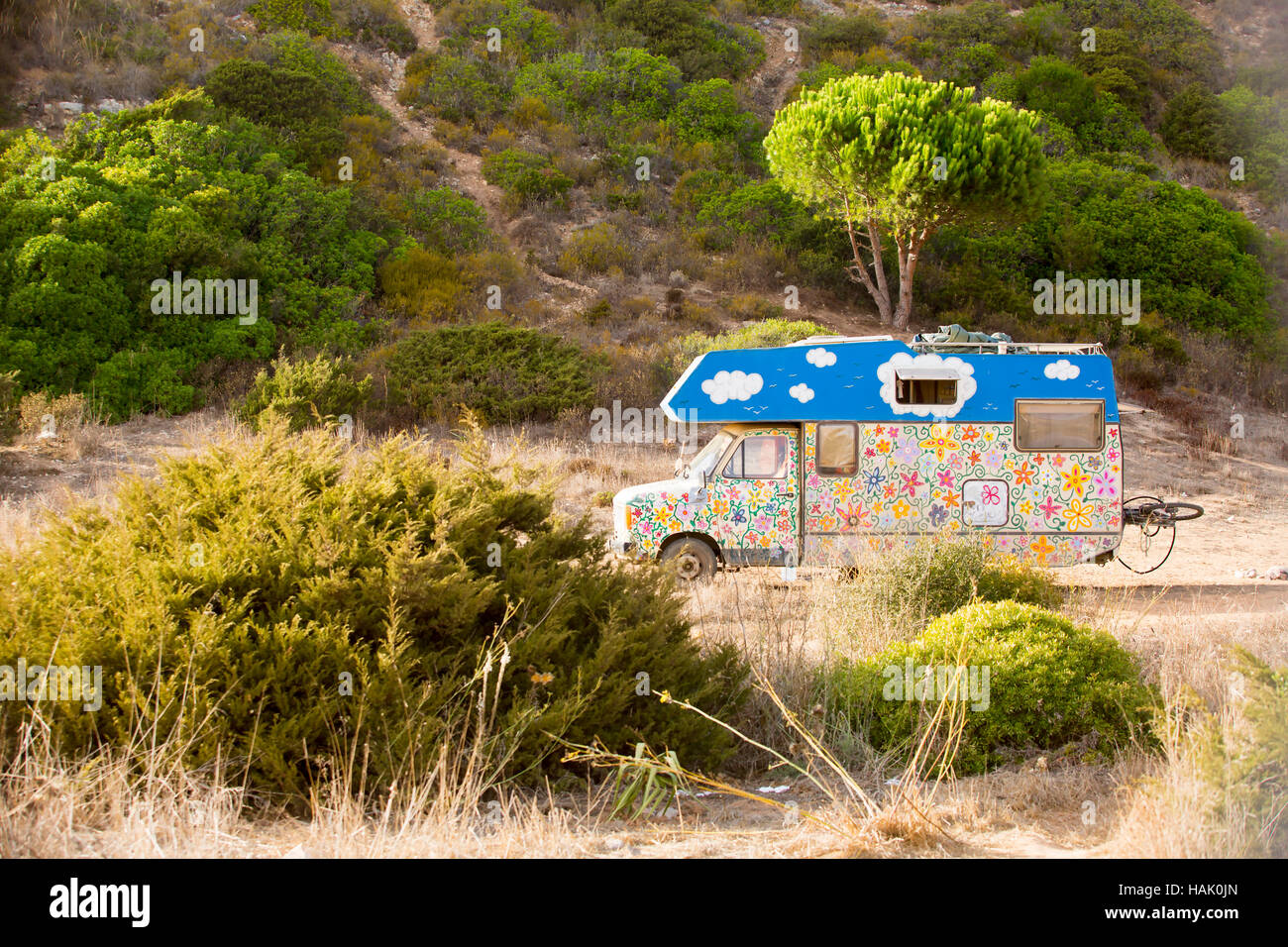 old retro hippie camper at Zavial beach in Portugal Stock Photo
