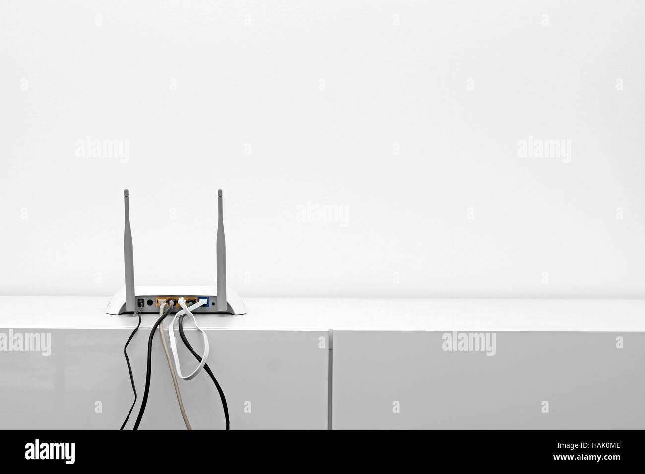 wifi internet router on shelf in white interior Stock Photo