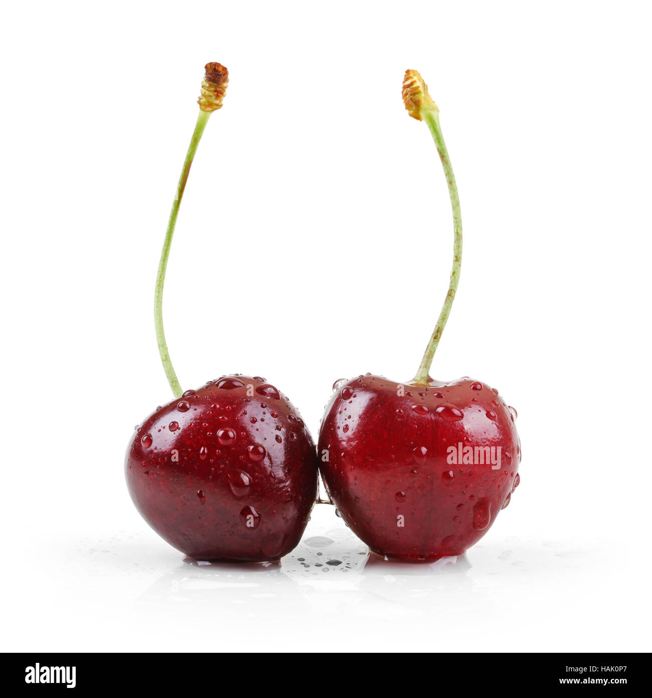 two wet cherries isolated on white Stock Photo