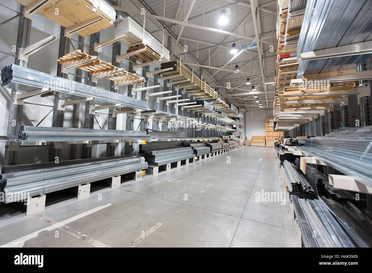construction material warehouse, shelves with aluminum profiles Stock Photo