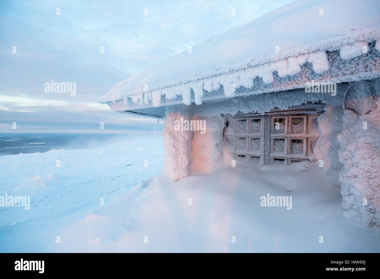 ice frozen house in Finland behind arctic circle Stock Photo