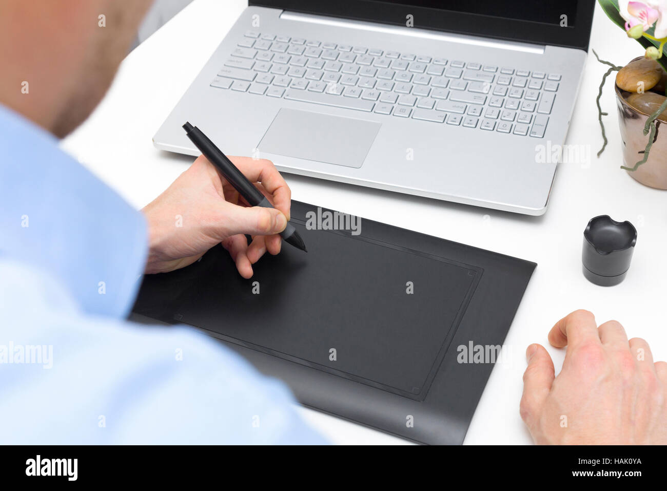graphic designer drawing on digital pen tablet Stock Photo