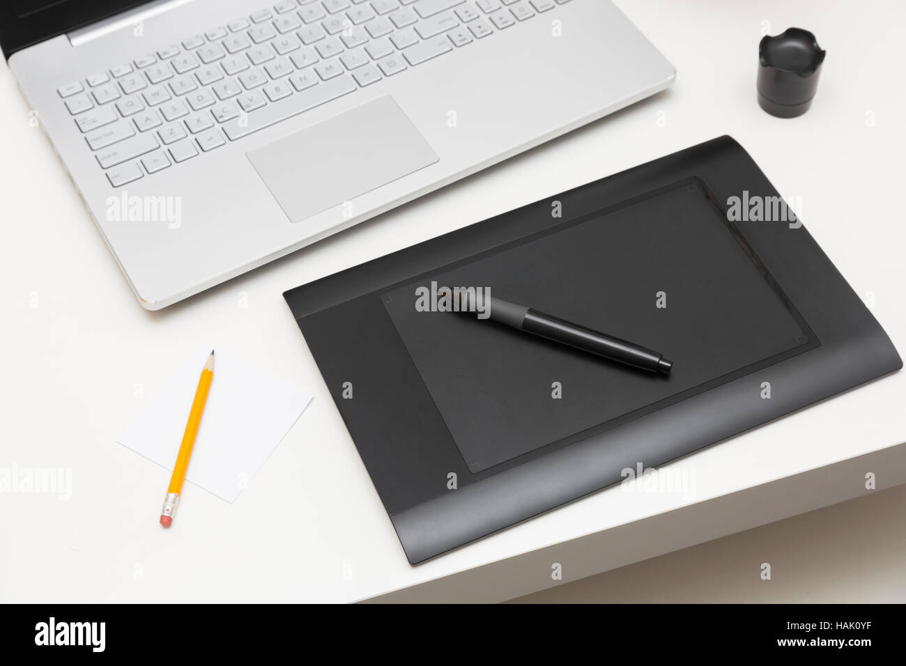 digital drawing tablet and laptop on the table Stock Photo