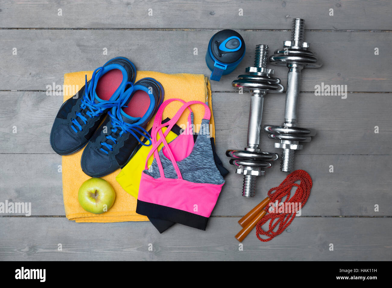 top view of colorful fitness equipment on wooden floor Stock Photo