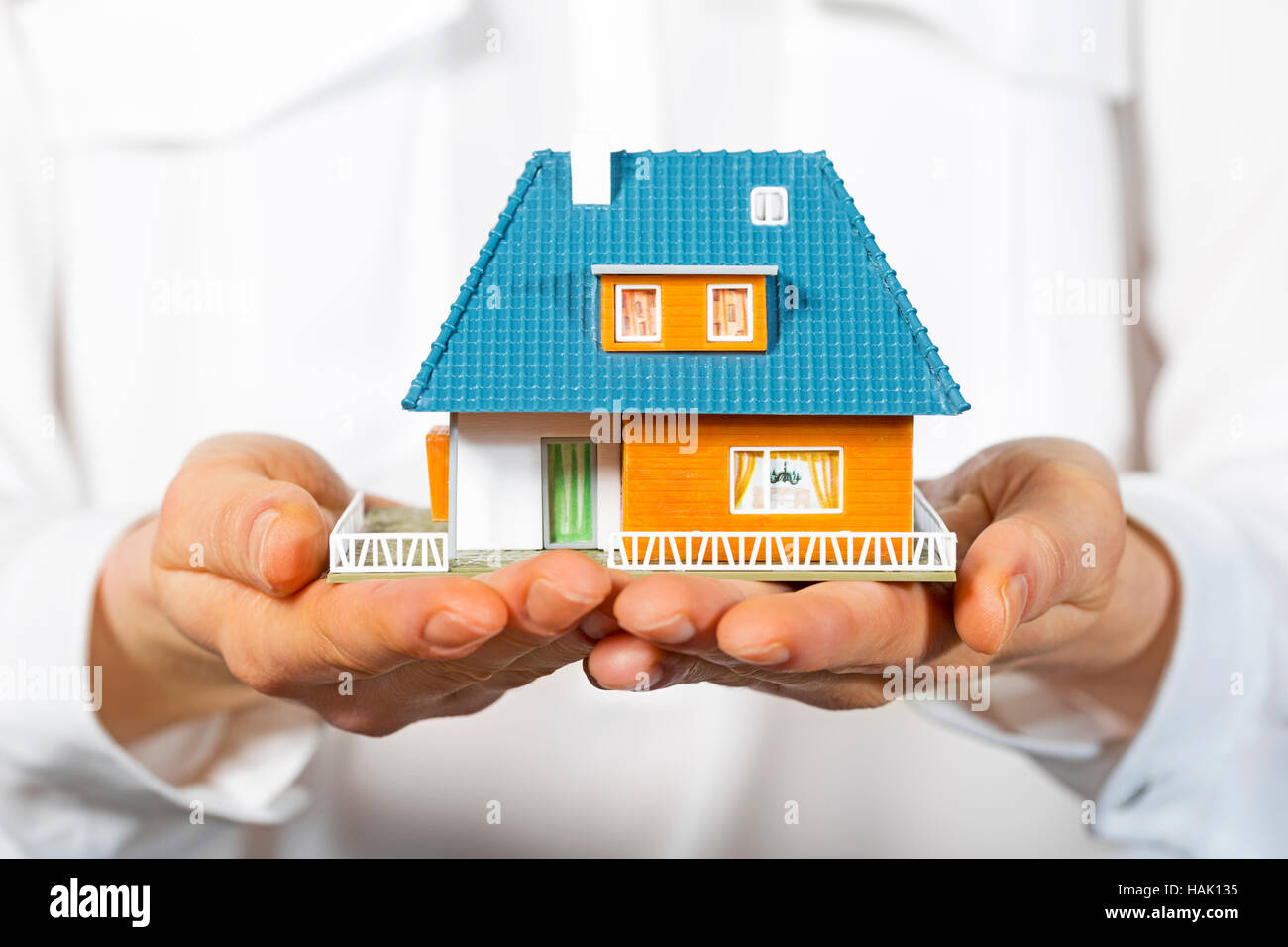 house in human hands, concept of new real estate Stock Photo