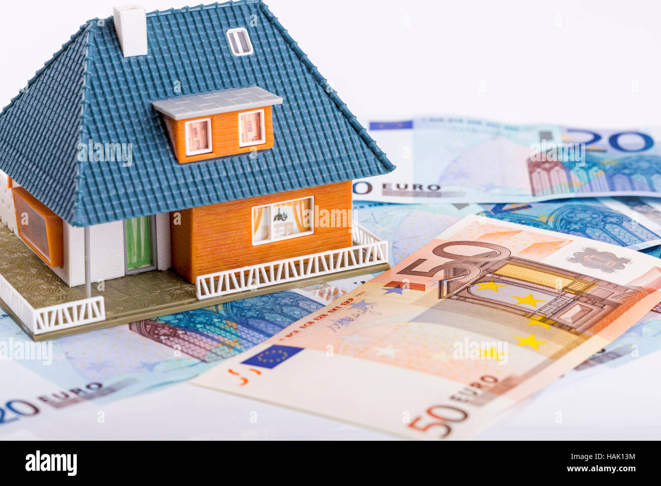 miniature house model on euro money banknotes. real estate industry concept Stock Photo
