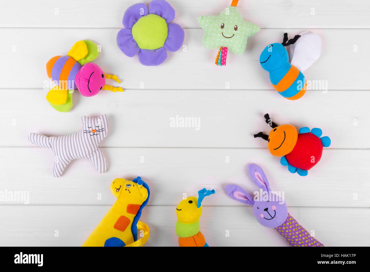 top view with soft baby toys on wooden background Stock Photo