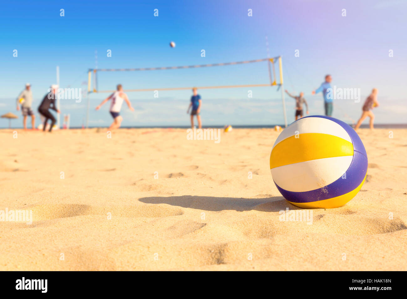 group of friends playing beach volleyball Stock Photo