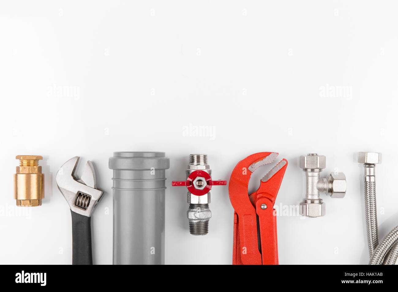 plumbing tools and equipment on white with copy space Stock Photo