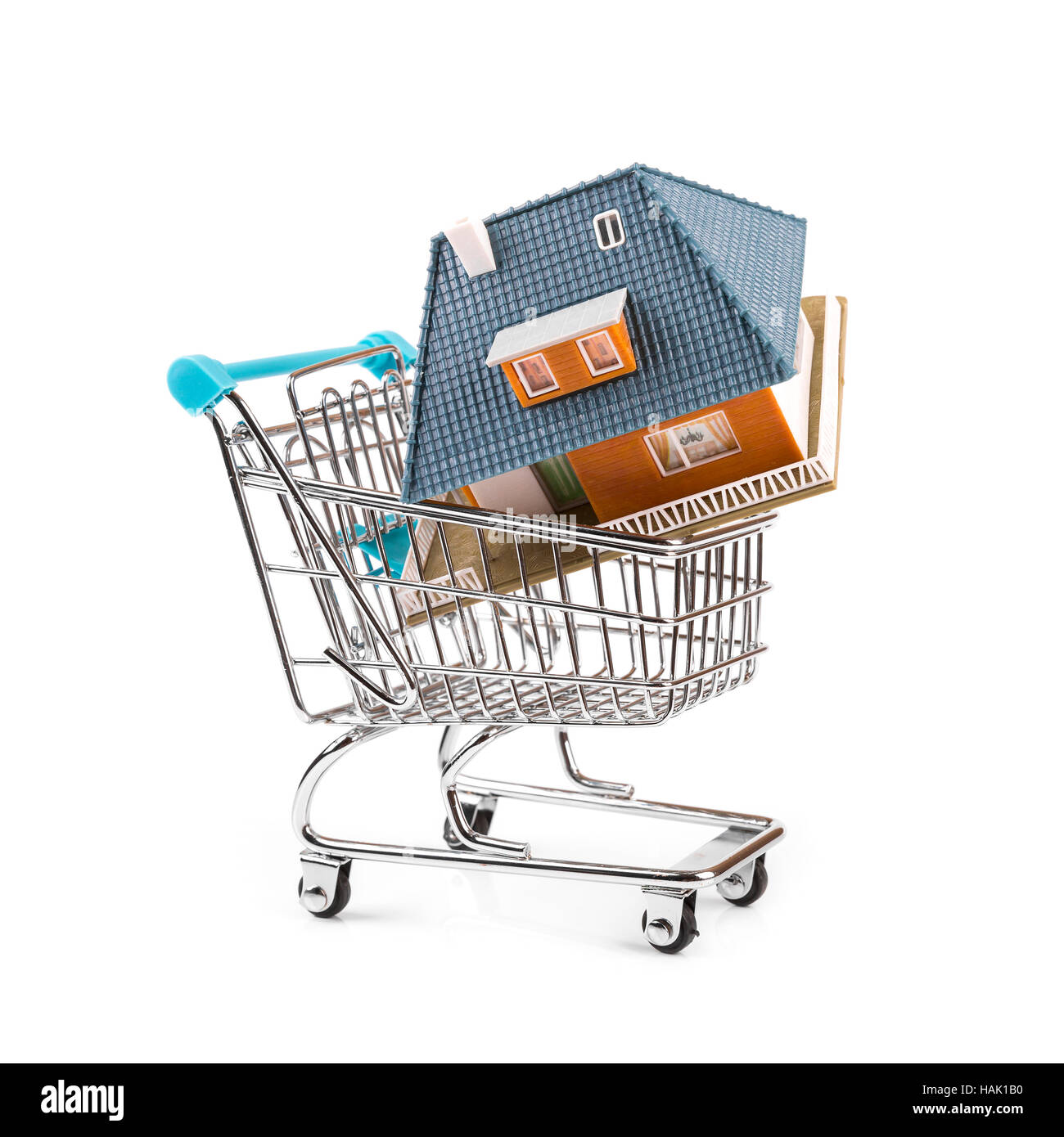 buy new real estate concept, house in a shopping cart Stock Photo