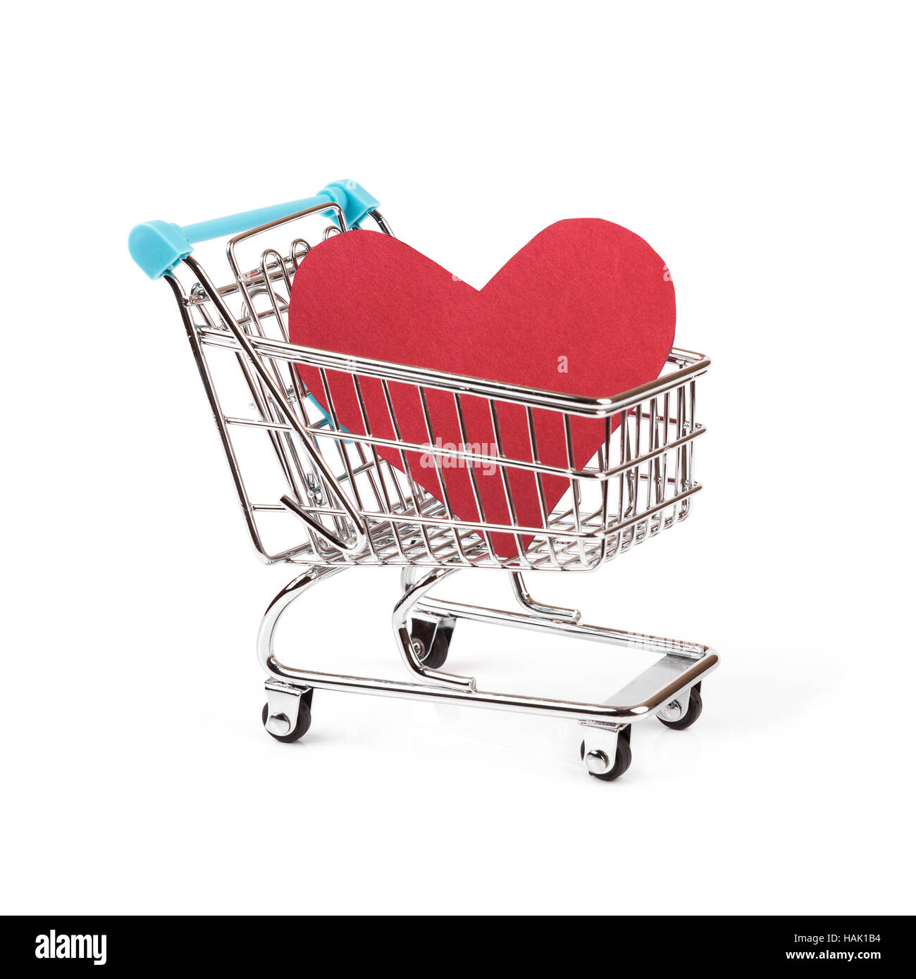 buy love concept, heart in shopping cart on white Stock Photo