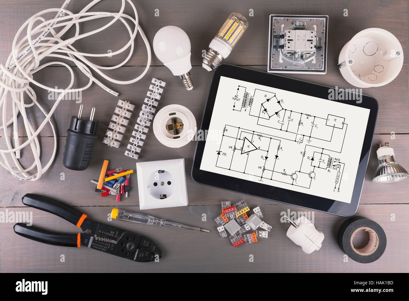 digital tablet with circuit scheme and electrical equipment Stock Photo