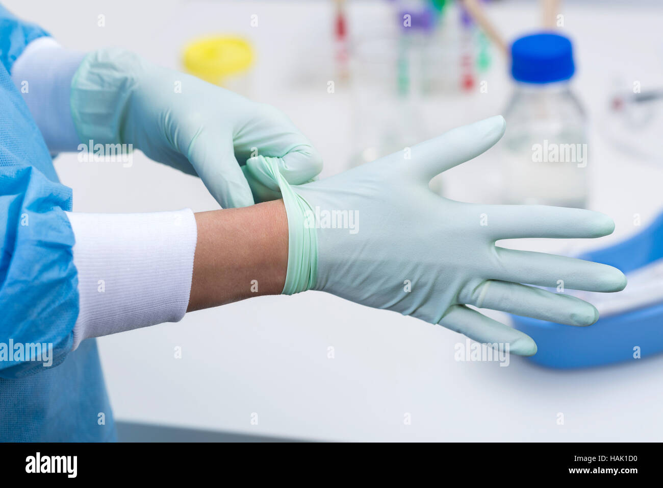 doctor putting on surgical gloves Stock Photo