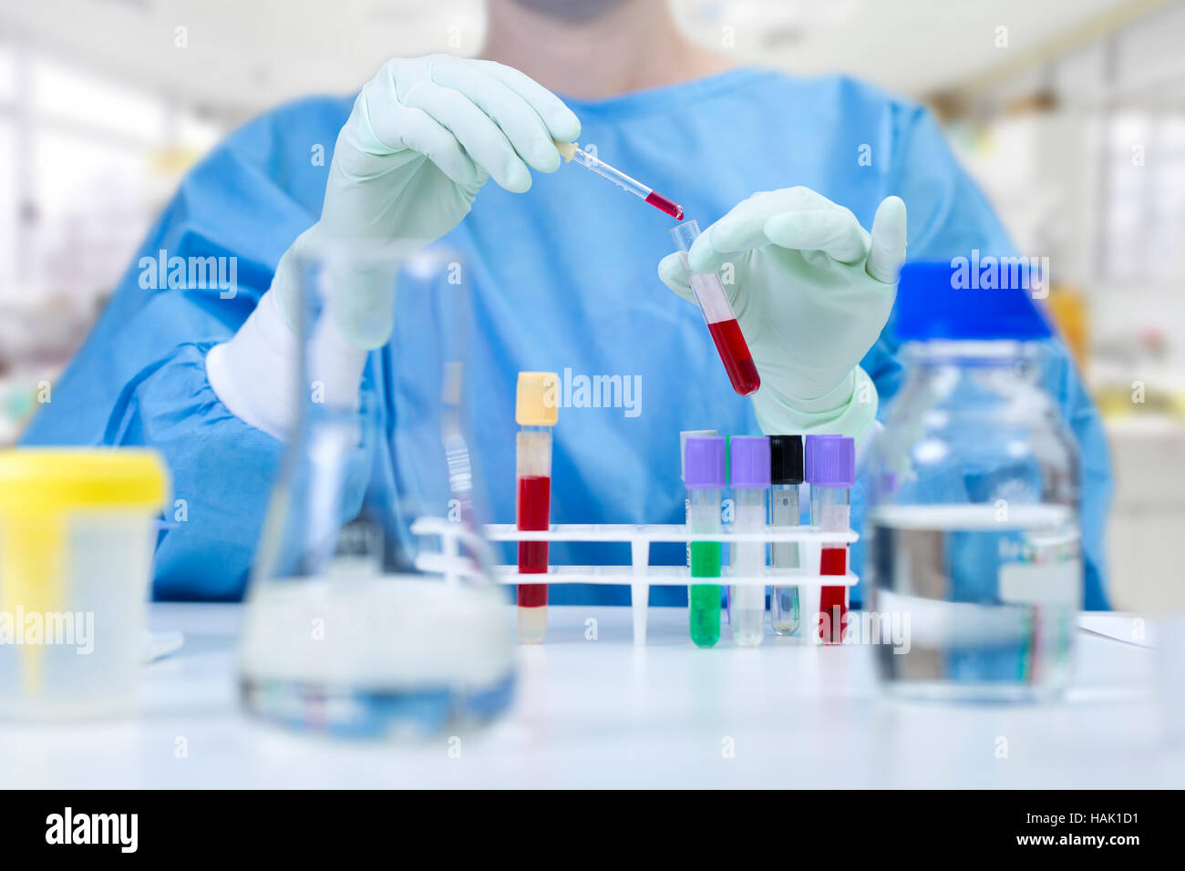 chemist analyzing liquid samples in a laboratory Stock Photo - Alamy