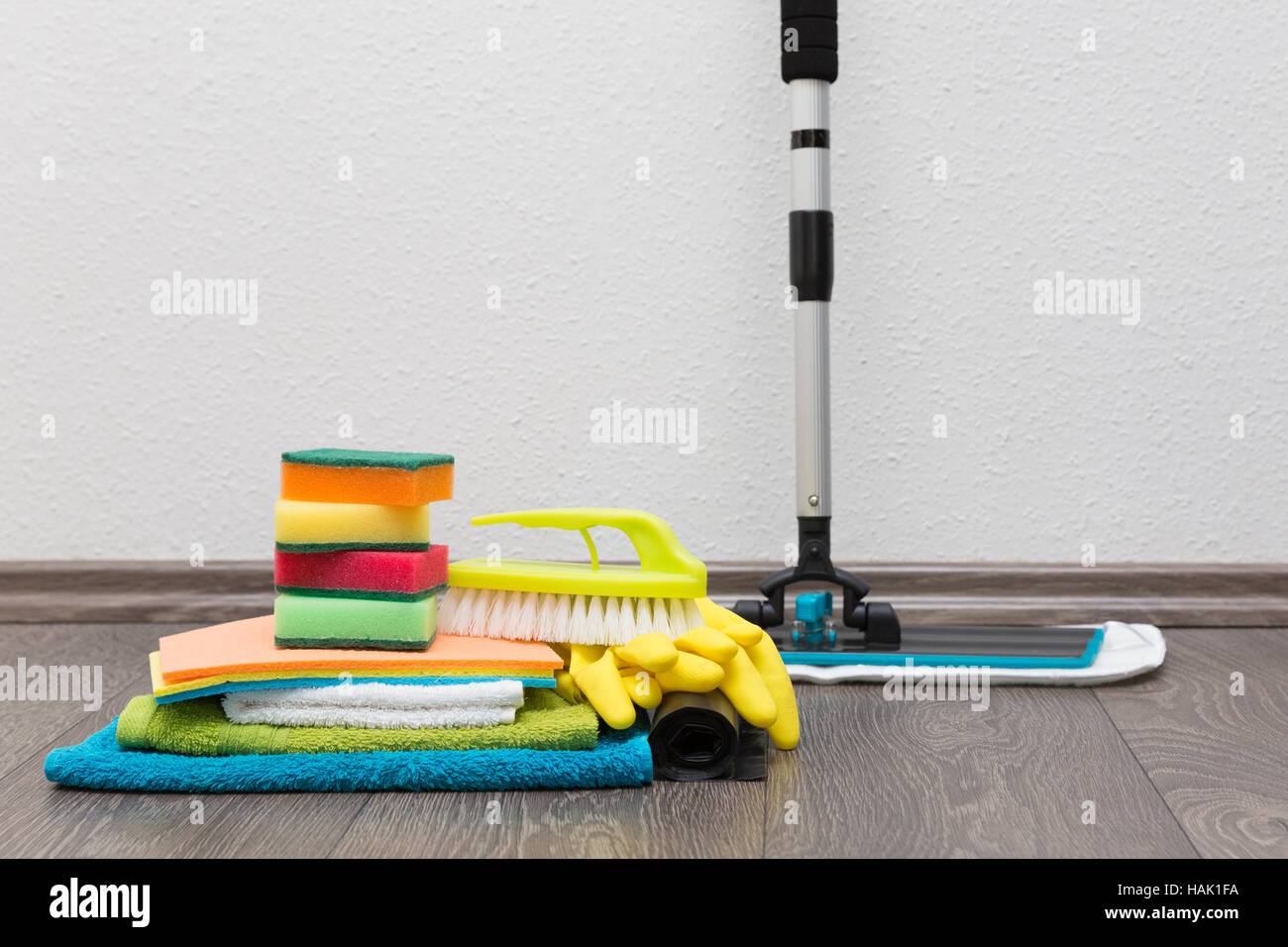 cleaning equipment on the floor against white wall Stock Photo