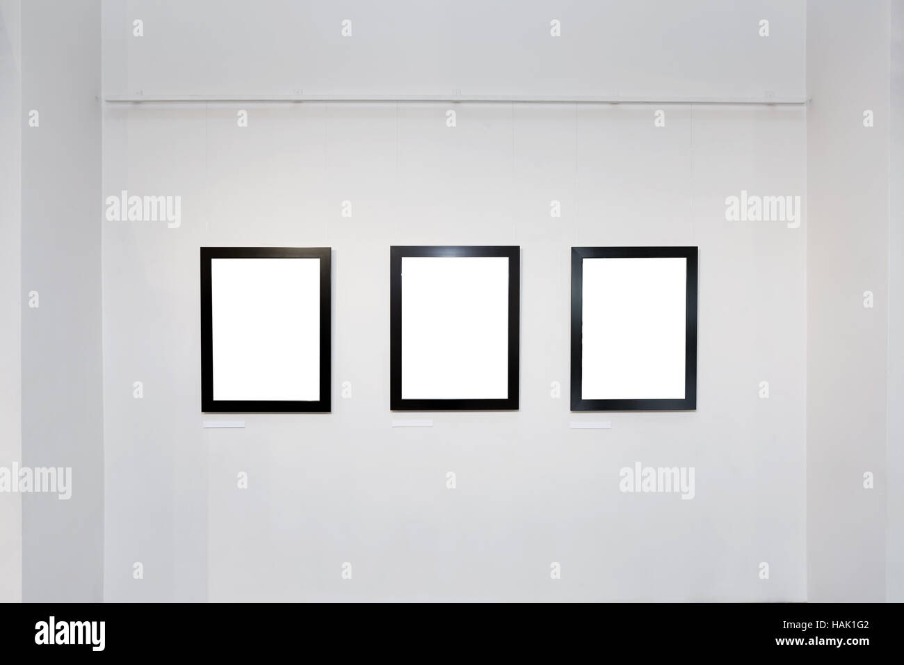 exhibition gallery interior with empty frames on wall Stock Photo