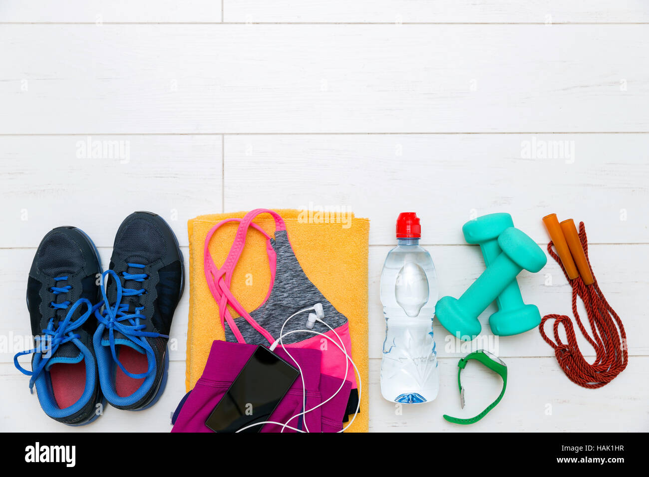 fitness equipment and accessories on white wooden gym floor Stock Photo