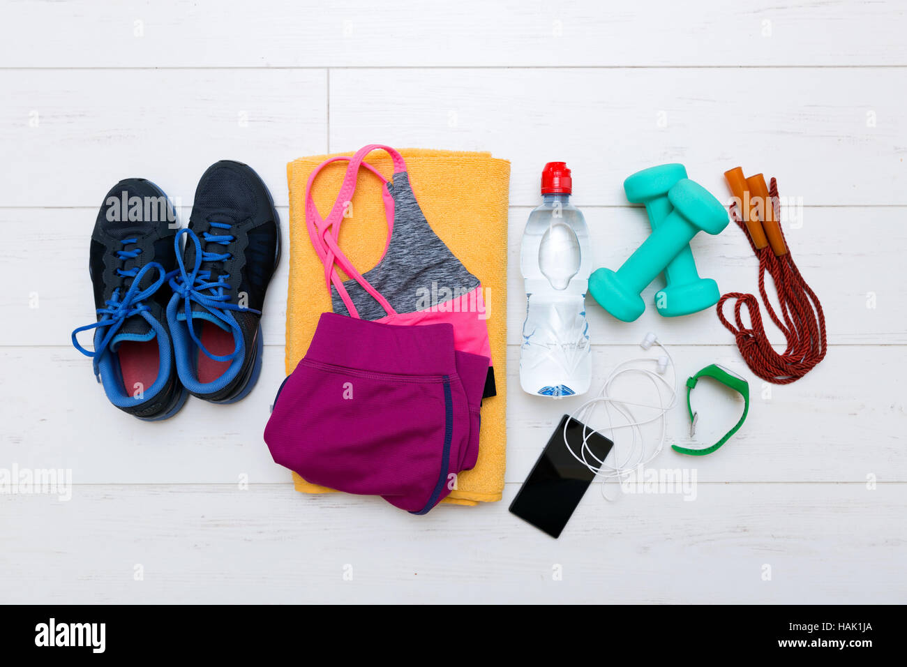 top view of fitness workout items on white gym floor Stock Photo Alamy