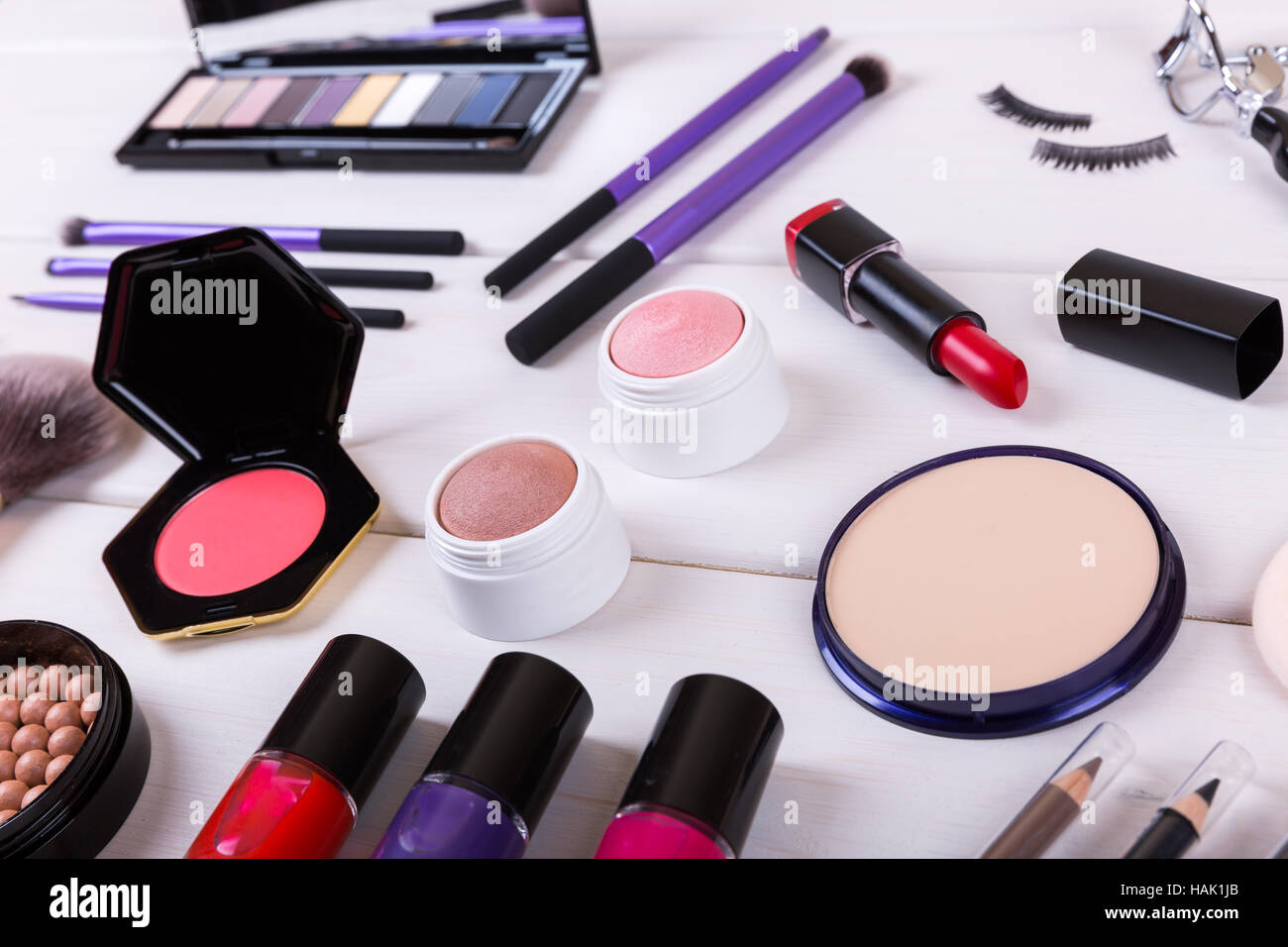 closeup of makeup cosmetics on wooden table Stock Photo