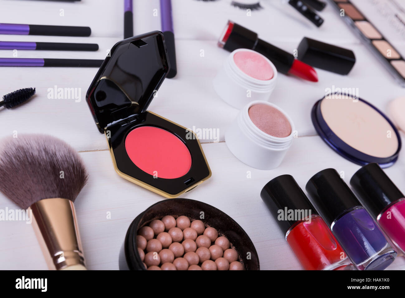 collection of makeup cosmetics products on wooden table Stock Photo