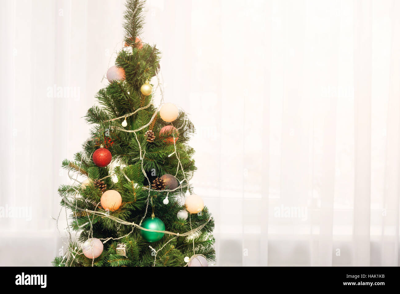 christmas tree standing in the room at home with copy space Stock Photo