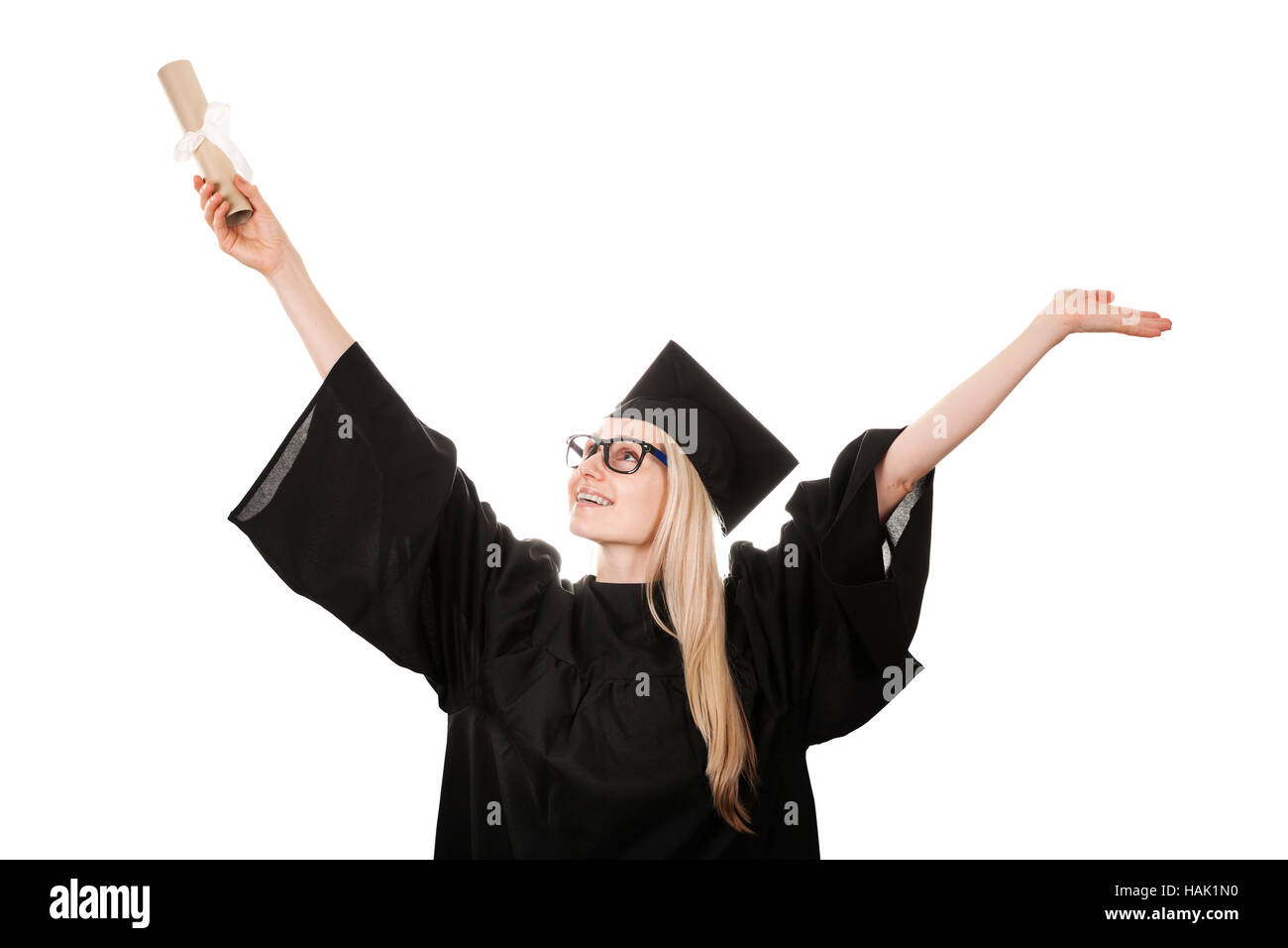 happy college graduate wearing cap and gown holding diploma. isolated on white Stock Photo