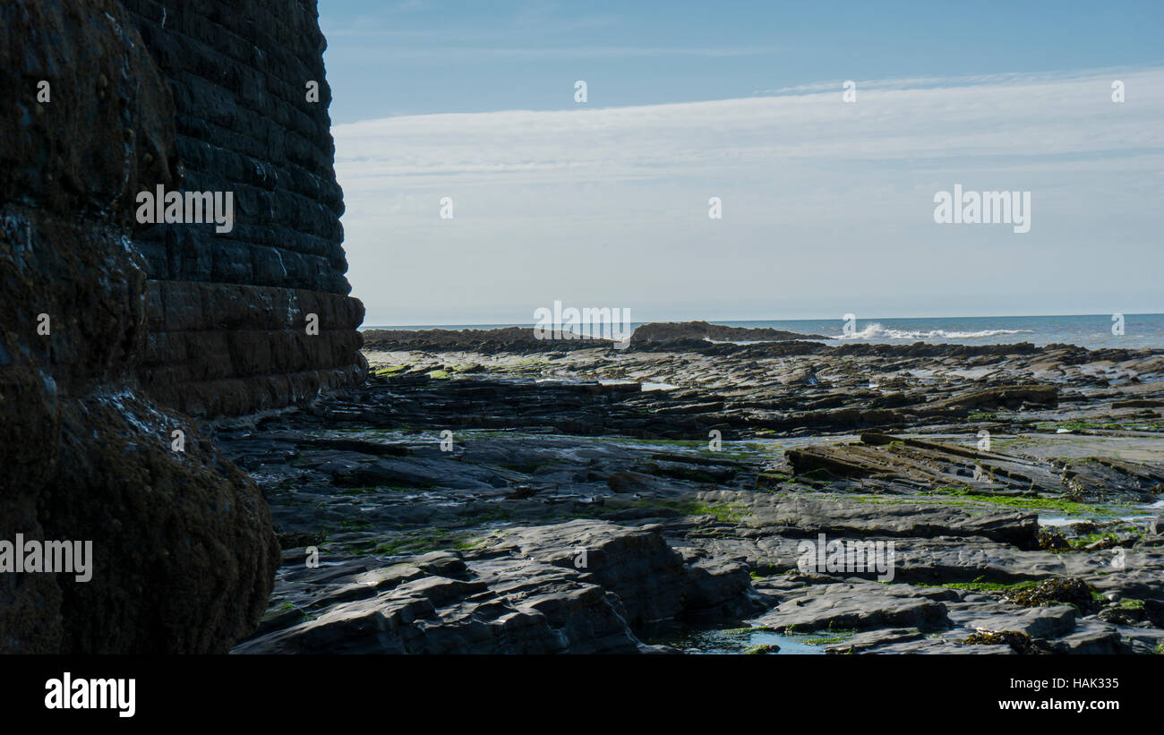 Stone wall wich protect the city by ocean ebb Stock Photo
