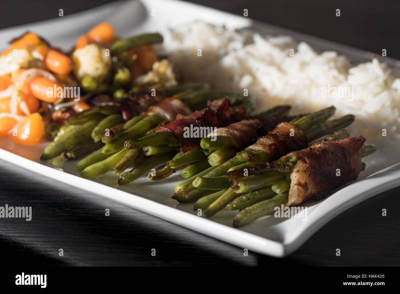 Low Carb Green beans wrapped in bacon woth mixed vegetables and rice