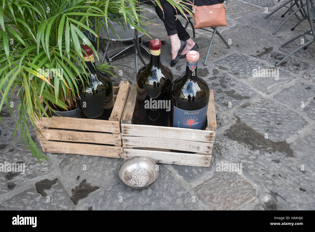 Famous Italian wine in wooden boxes on the cafe floor, Florence