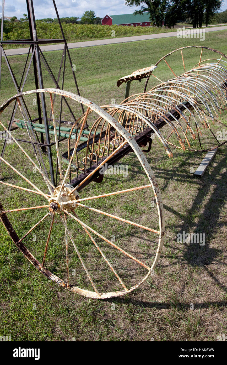 Antique vintage farm hay rake for sale at Pixie Woods Sales. Clitherall Minnesota MN USA Stock Photo