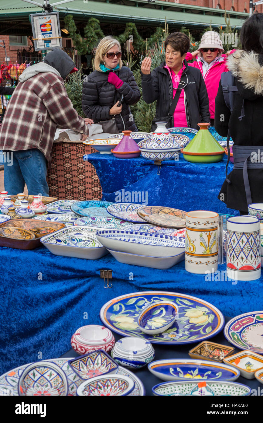 Washington, DC Shoppers buy pottery from outdoor vendors at historic Eastern Market Stock
