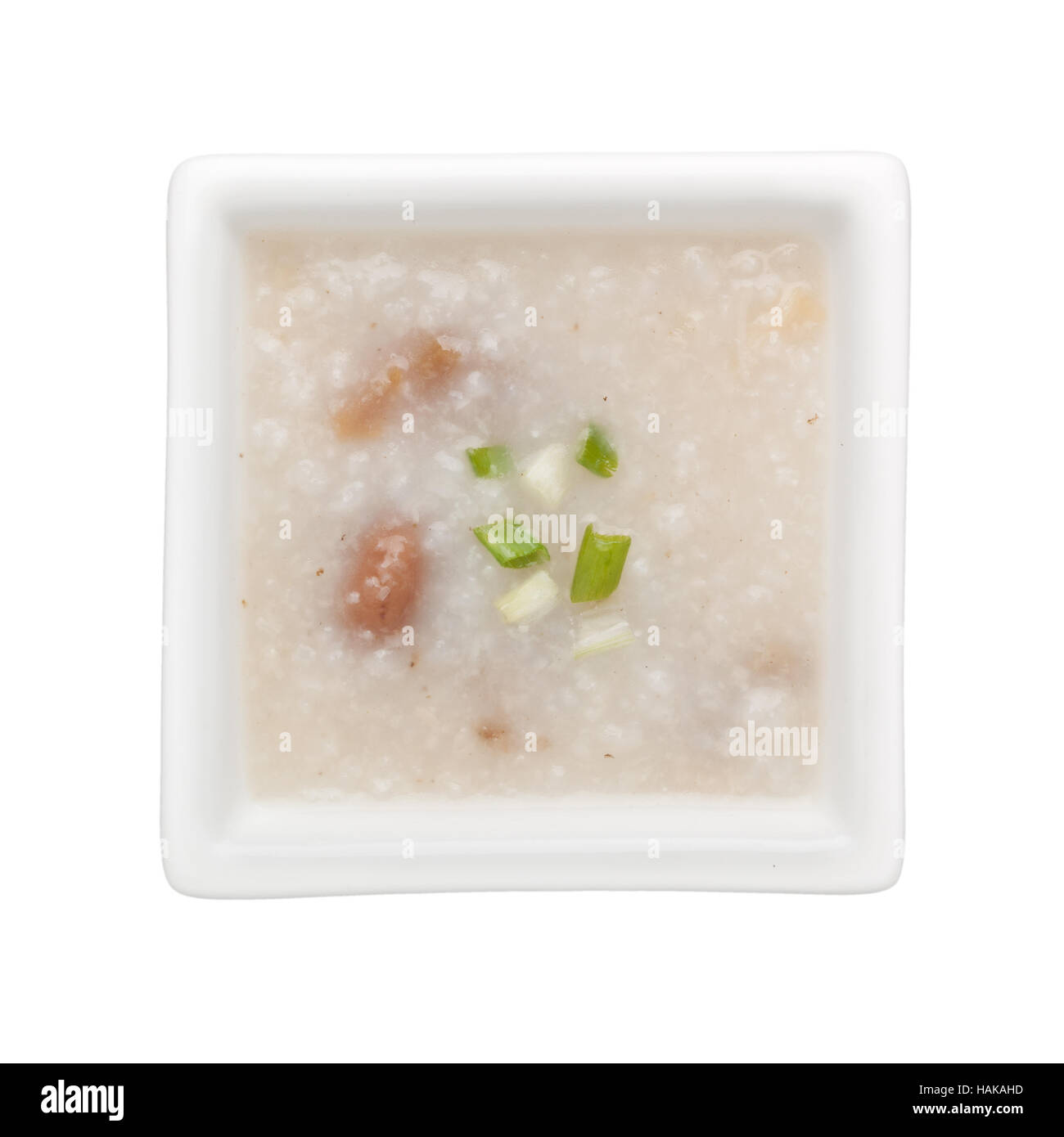 Chinese congee in a square bowl isolated on white background Stock Photo