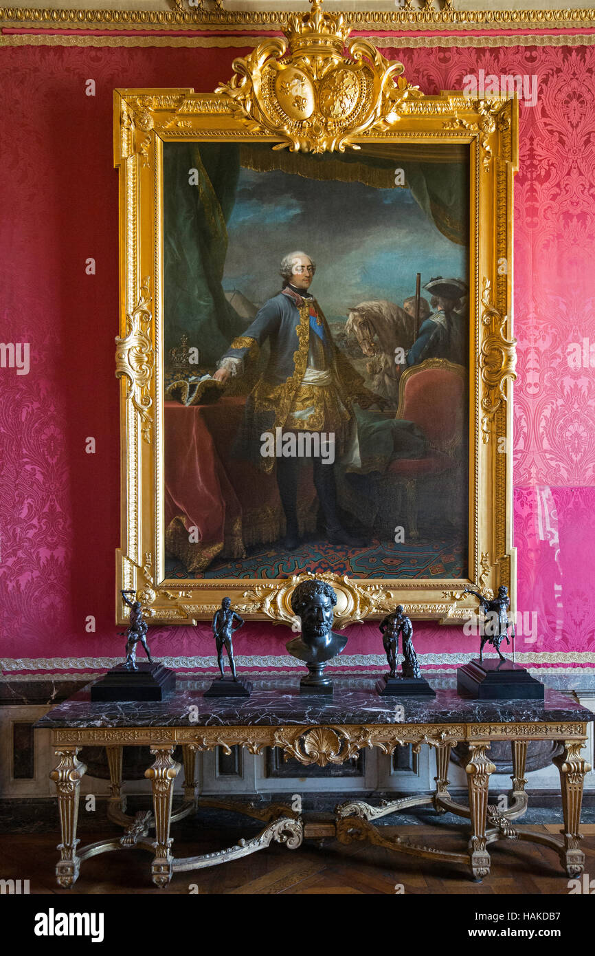 Paintings in gold gilt frames in Louise X1V bedroom in the palace in Versailles France Stock Photo