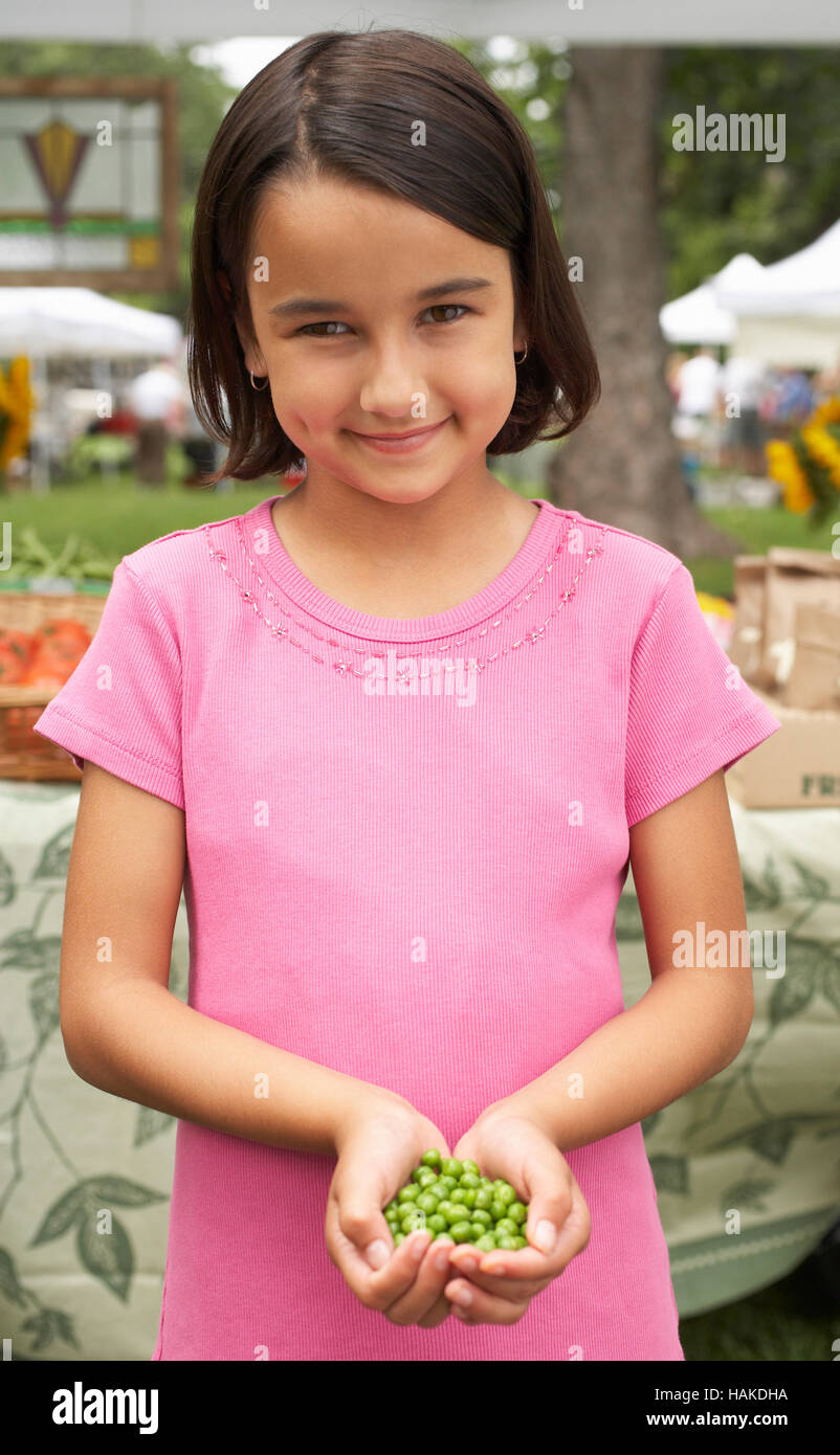 Girl Holding Peas Stock Photo