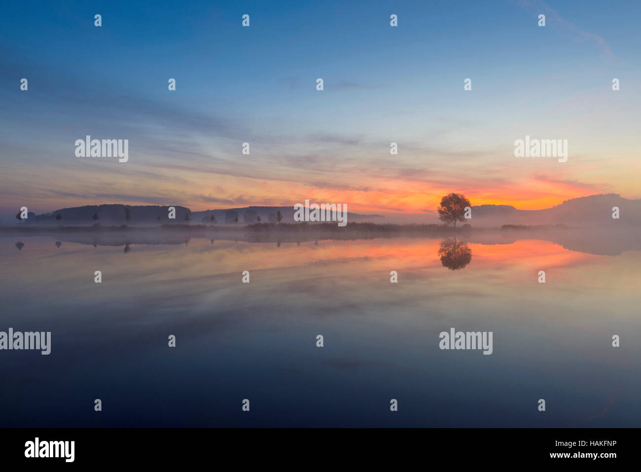 Landscape Reflecting in Lake at Dawn, Drei Gleichen, Ilm District, Thuringia, Germany Stock Photo